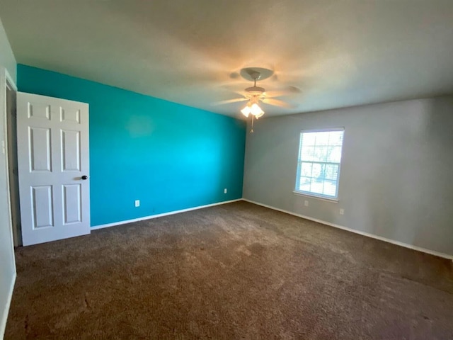 carpeted empty room with ceiling fan