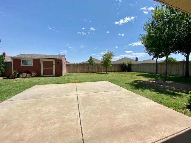 view of yard with a shed and a patio