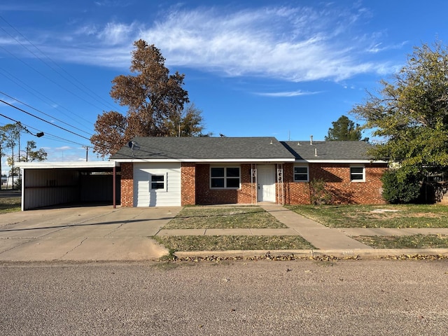 single story home featuring a carport and a front lawn