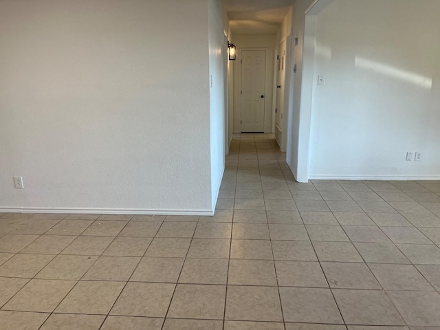 unfurnished room with light tile patterned floors