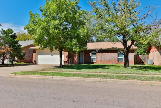 view of front of property with a garage and a front yard