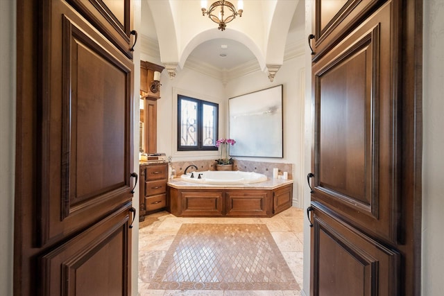 full bathroom featuring crown molding and a garden tub