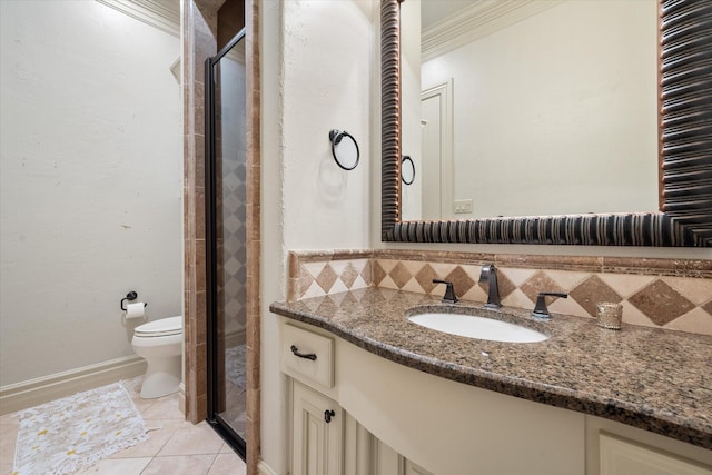 bathroom with tile patterned floors, toilet, backsplash, a shower stall, and vanity