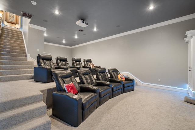 carpeted home theater with visible vents, recessed lighting, crown molding, and baseboards