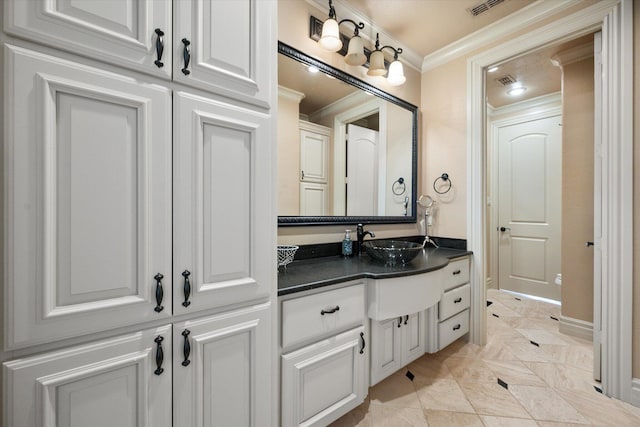 bathroom with vanity and crown molding