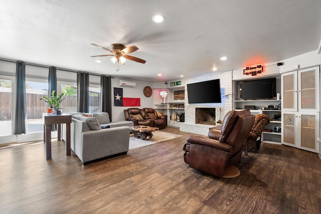 living area featuring dark wood-style floors, recessed lighting, a ceiling fan, and a wall mounted AC