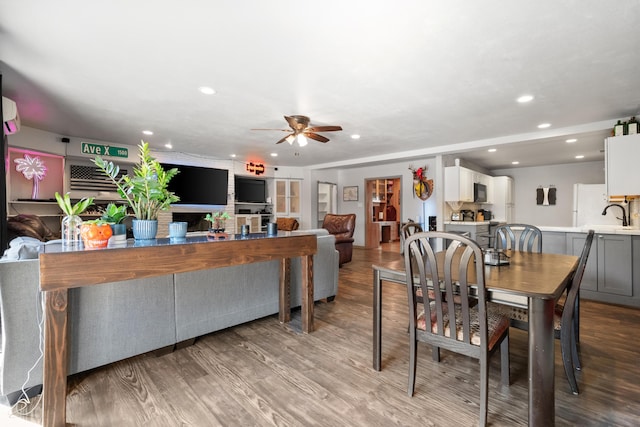 dining area featuring wood finished floors, recessed lighting, and a ceiling fan