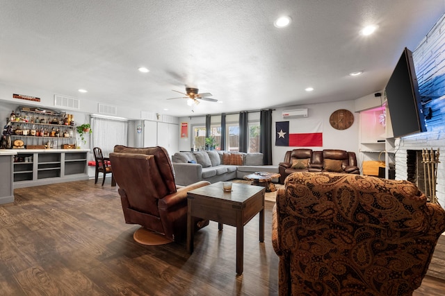 living area with a wall unit AC, a bar, wood finished floors, and ceiling fan