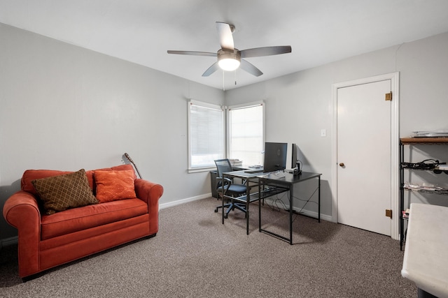 office area with a ceiling fan, baseboards, and carpet floors