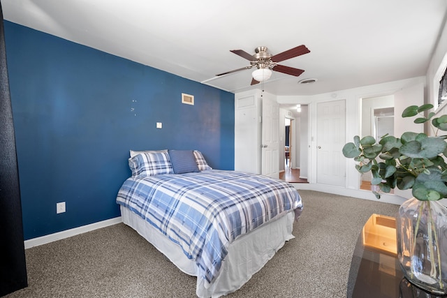 bedroom with carpet, visible vents, a ceiling fan, and baseboards