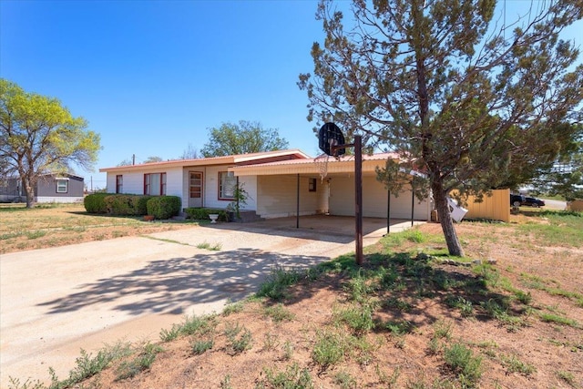 ranch-style home with a carport