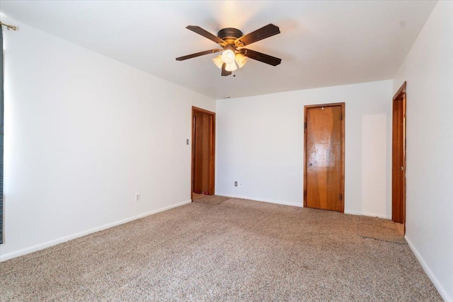 unfurnished bedroom featuring carpet floors and ceiling fan