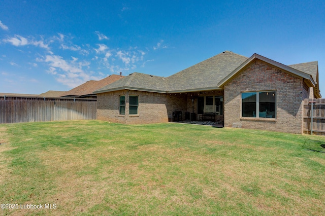 5713 116th St, Lubbock, TX 79424 - rear view of property featuring brick siding and roof with shingles