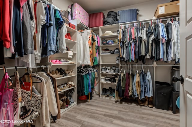 5713 116th St, Lubbock, TX 79424 - spacious closet featuring wood finished floors