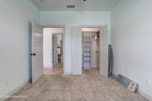 5713 116th St, Lubbock, TX 79424 - unfurnished bedroom featuring carpet flooring, a spacious closet, a closet, and baseboards