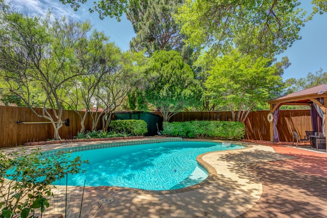 4615 11th St, Lubbock, TX 79416 - view of swimming pool featuring a gazebo, a fenced backyard, and a patio area