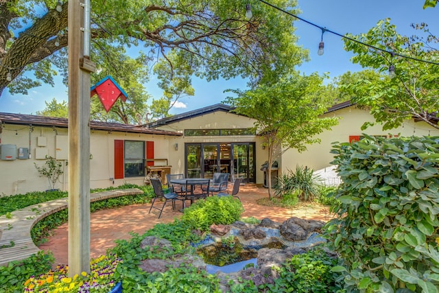 4615 11th St, Lubbock, TX 79416 - rear view of property with a patio