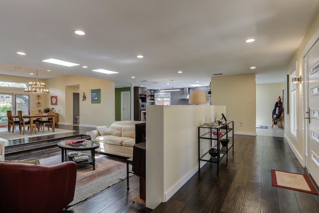 4615 11th St, Lubbock, TX 79416 - living room with a chandelier, dark wood finished floors, recessed lighting, and healthy amount of natural light