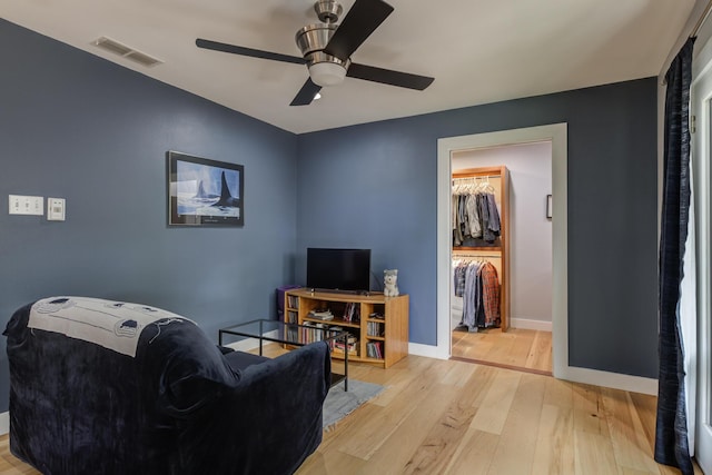 4615 11th St, Lubbock, TX 79416 - living area featuring wood finished floors and ceiling fan