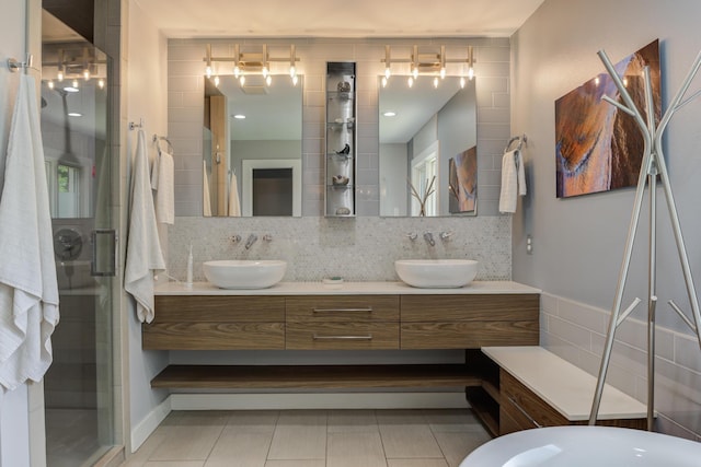 4615 11th St, Lubbock, TX 79416 - bathroom with double vanity, decorative backsplash, a shower stall, and tile patterned floors