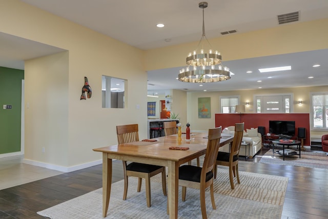 4615 11th St, Lubbock, TX 79416 - dining area with a chandelier, hardwood / wood-style flooring, and recessed lighting