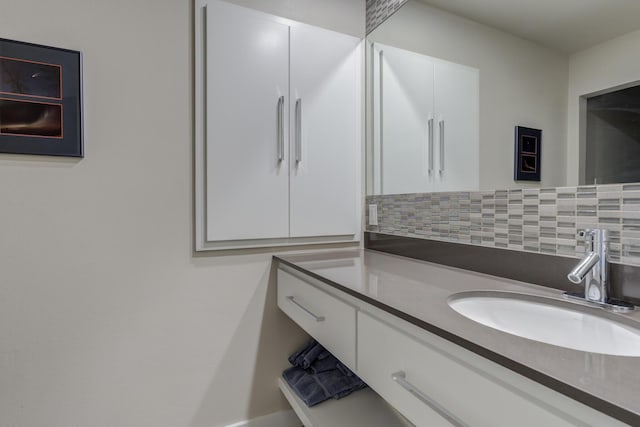 4615 11th St, Lubbock, TX 79416 - bathroom featuring vanity and tasteful backsplash