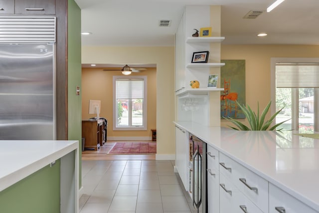 4615 11th St, Lubbock, TX 79416 - kitchen with open shelves, stainless steel built in refrigerator, healthy amount of natural light, light countertops, and recessed lighting
