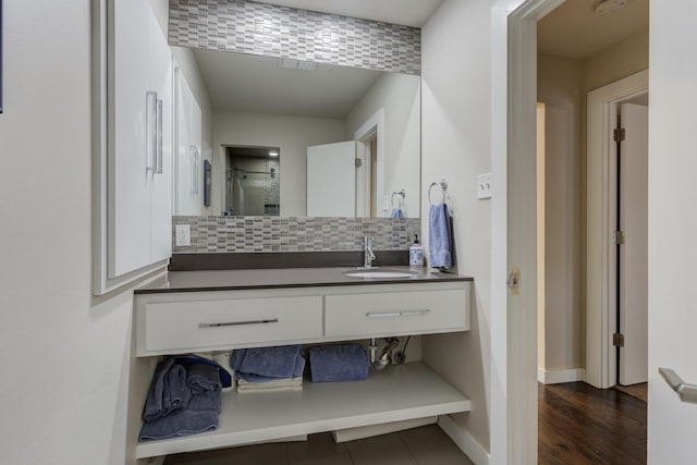 4615 11th St, Lubbock, TX 79416 - bathroom featuring decorative backsplash and vanity