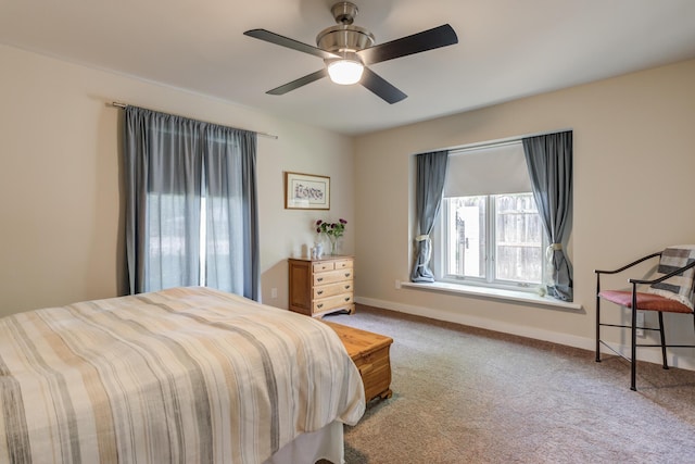 4615 11th St, Lubbock, TX 79416 - carpeted bedroom featuring baseboards and ceiling fan