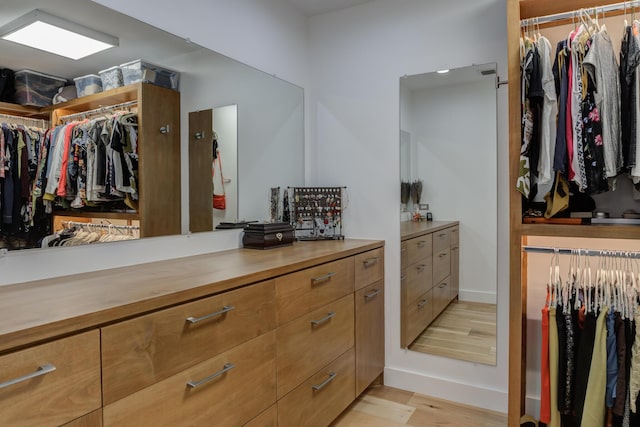 4615 11th St, Lubbock, TX 79416 - walk in closet with light wood-type flooring