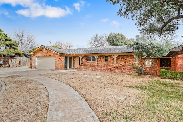 single story home with a garage