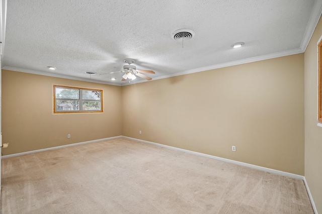 carpeted empty room featuring crown molding, a textured ceiling, and ceiling fan