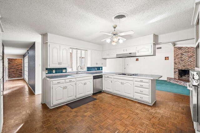 kitchen featuring dishwasher, white cabinetry, sink, and kitchen peninsula