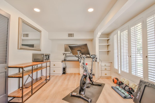 workout area with light wood-type flooring