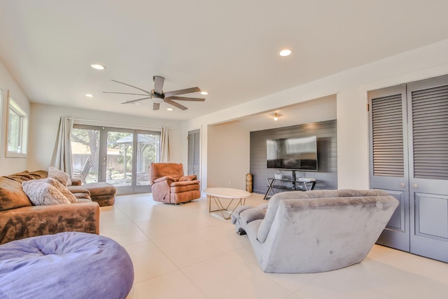 living room featuring french doors and ceiling fan