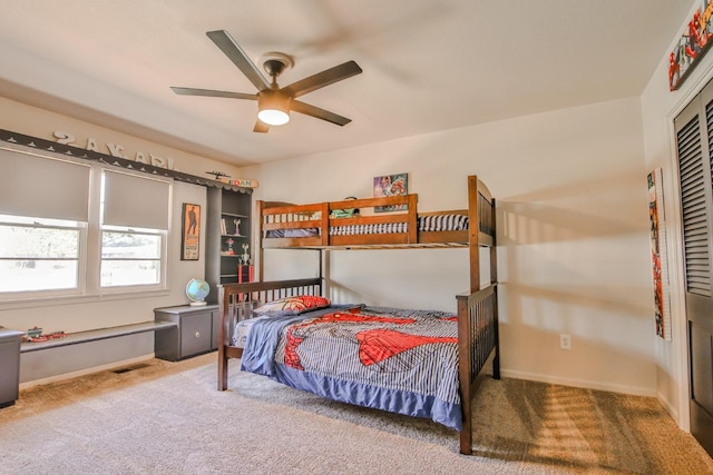 carpeted bedroom with ceiling fan