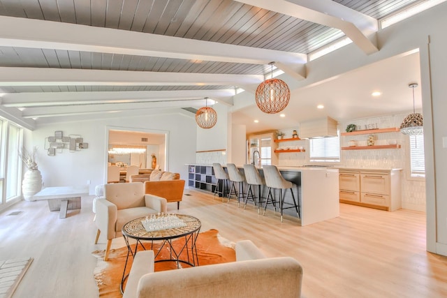 living room featuring wood ceiling, light hardwood / wood-style floors, and lofted ceiling with beams