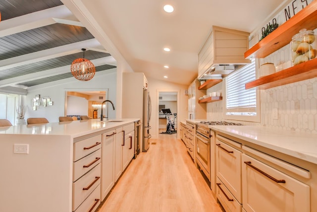 kitchen with pendant lighting, high end range, light hardwood / wood-style flooring, and vaulted ceiling with beams