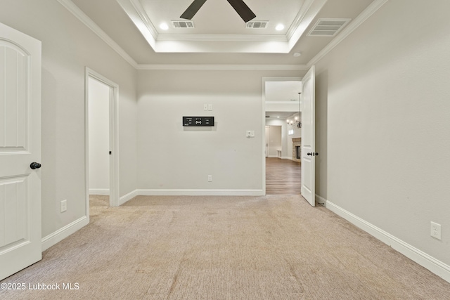 1016 N Genoa Ave, Lubbock, TX 79416 - empty room with a ceiling fan, crown molding, light carpet, a raised ceiling, and recessed lighting
