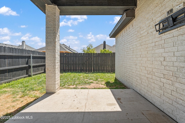 1016 N Genoa Ave, Lubbock, TX 79416 - fenced backyard with a patio area