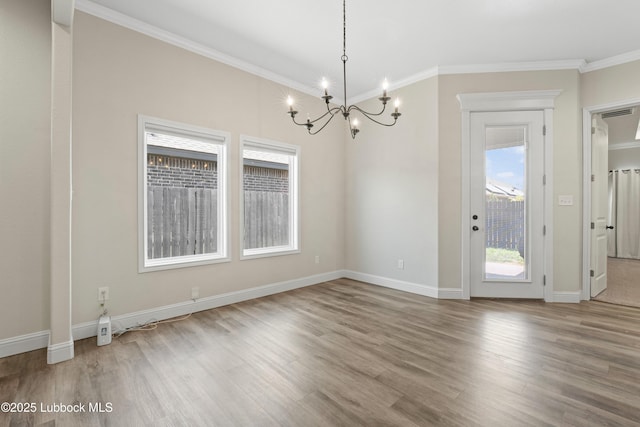 1016 N Genoa Ave, Lubbock, TX 79416 - unfurnished dining area with a chandelier, wood finished floors, and ornamental molding