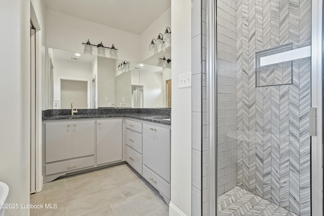 1016 N Genoa Ave, Lubbock, TX 79416 - bathroom featuring double vanity, a stall shower, and tile patterned flooring