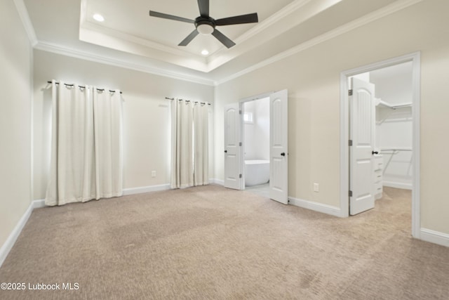 1016 N Genoa Ave, Lubbock, TX 79416 - unfurnished bedroom with ornamental molding, light carpet, a raised ceiling, recessed lighting, and a spacious closet