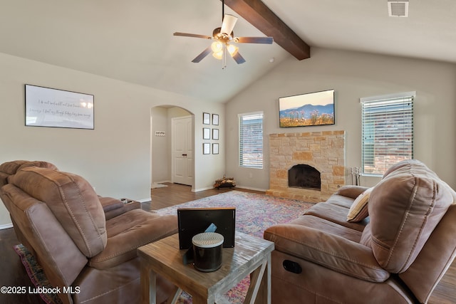 7905 Ave K, Lubbock, TX 79423 - living area with wood finished floors, ceiling fan, arched walkways, and healthy amount of natural light