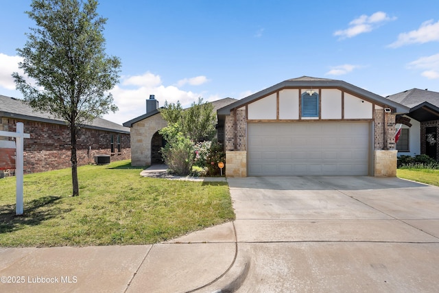 7905 Ave K, Lubbock, TX 79423 - view of front facade featuring an attached garage, driveway, a front yard, a chimney, and brick siding