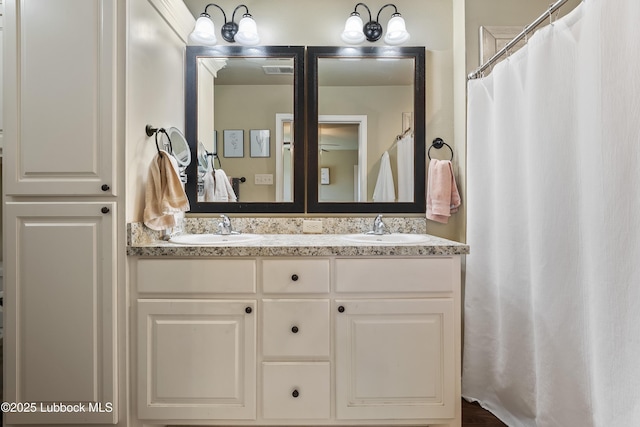 7905 Ave K, Lubbock, TX 79423 - full bathroom with double vanity and a shower with curtain