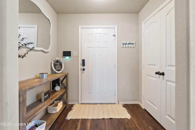 7905 Ave K, Lubbock, TX 79423 - foyer entrance featuring dark wood-style flooring and baseboards