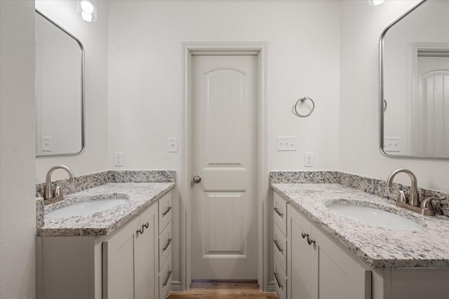 bathroom featuring vanity and hardwood / wood-style flooring