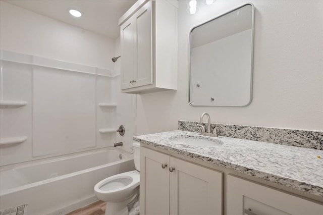 full bathroom featuring vanity, wood-type flooring,  shower combination, and toilet