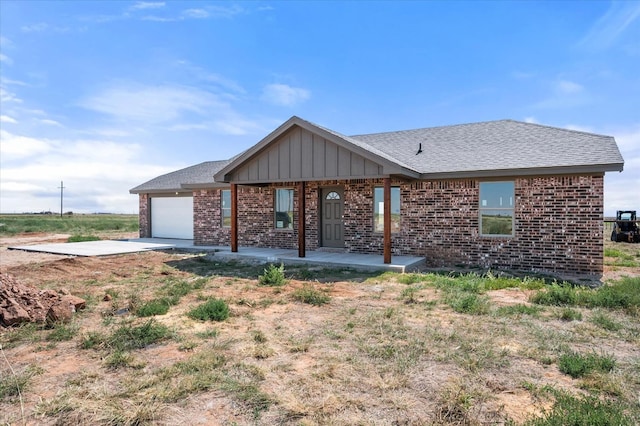 ranch-style house featuring a garage